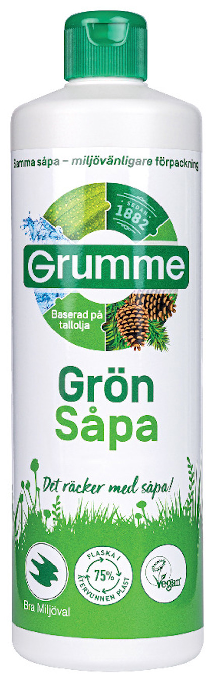 Grön flaska Grumme Grön Såpa med grön kork, etikett med text och miljövänliga symboler.