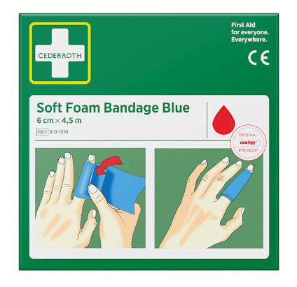 Grön förpackning med ett kors, texten "Soft Foam Bandage Blue", och instruktioner för applicering av ett blått bandage på en hand.