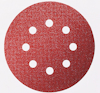 Röd, rund sandpappersslipad med sju jämnt fördelade hål.